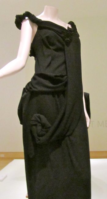 In the late 70s, Yohji Yamamoto became a professional and romantic partner of Rei Kawakubo and their relationship unavoidably influenced each other’s work. He debuted for the first time in Tōkyō in 1977 and in 1981, his collections appeared in the Parisian fashion shows as well, initially under the label “Y’s”. This brand is nowadays his “value-oriented” line. Much like Rei Kawakubo, Yamamoto’s first goal was to offer women a different kind of beauty. Thus, his first collections mainly consist of a post-apocalyptic aesthetic obtained by the creation of torn, amorphic clothes. On his shows, women walk on the runaway wearing oversize, multi-layered garments, and there is no difference between men’s and women’s collections. Besides, Yamamoto enjoys matching modest and luxurious garments, combining chìc elements with humble fabrics. Yamamoto and Kawakubo both gave birth to what is still known by the name Boro Look, i.e. the Japanese word for “beggar”. In 1995, Yamamoto proposed a collection realised with shibori, the Japanese traditional tie-dye technique. However, the main character of his brand is the choice of black as the primary colour. Even when other colours are present in the outfits, they often have the task of further emphasizing its dominance. The result is a mysterious, gothic look that still represents the core of Yamamoto’s idea of fashion. Therefore, he also became one of the inspirational designers of the 80s Dark Wave. As years passed, his brand embodied some Western aesthetics in his fashion concept too. Gradually, more form-fitting garments started appearing alongside the usual baggy ones and fabrics like lace and tulle matched meeker fabrics like cotton and jersey. The Victorian-gothic aesthetic, in particular, became another symbol of Yamamoto’s fashion, alongside black colour.
